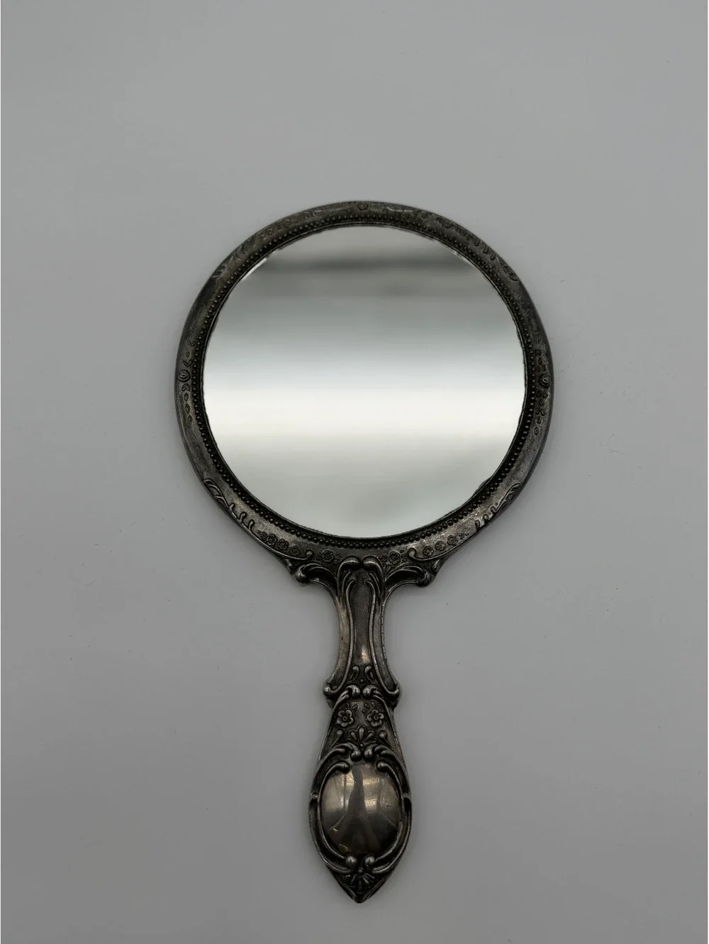 Vintage Ornate Silver Handheld Mirror with Floral Engraving